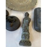 Group of Oriental bronze censer covers, a bronze figure and a bronze dragon plate