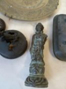 Group of Oriental bronze censer covers, a bronze figure and a bronze dragon plate