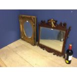 Two wall mirrors: oval mirror set in ornate gilt rectangular frame 58H x 52 W overall, and a