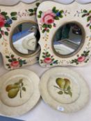 Pair of decorative oval mirrors set within a shaped rectangular frame painted with pink roses,