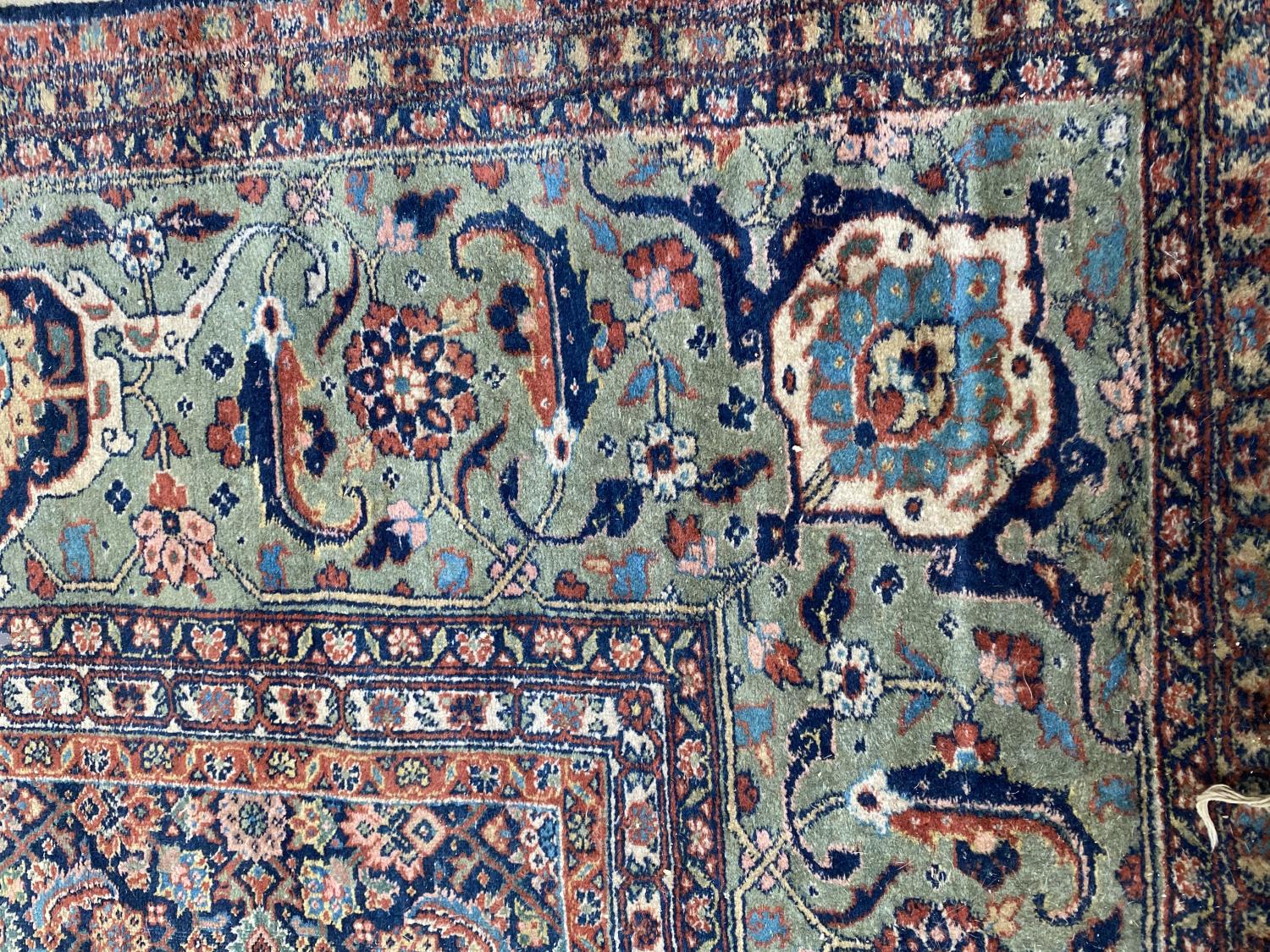 Large old Persian rug with dark blue ground and central panel within a green stylised rectangular - Image 2 of 8