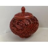 Chinese carved cinnabar lacquered pot and lid, 12cm D, (condition - some wear around lid edge )