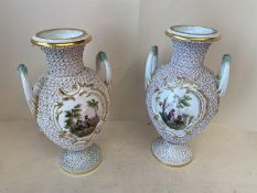 Pair of Fine quality porcelain Meissen urns, each with 2 handles and central panels, decorated