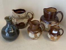 Set of 3 graduated Royal Doulton harvest jugs the largest 20 cm H, and a studio pottery vase and