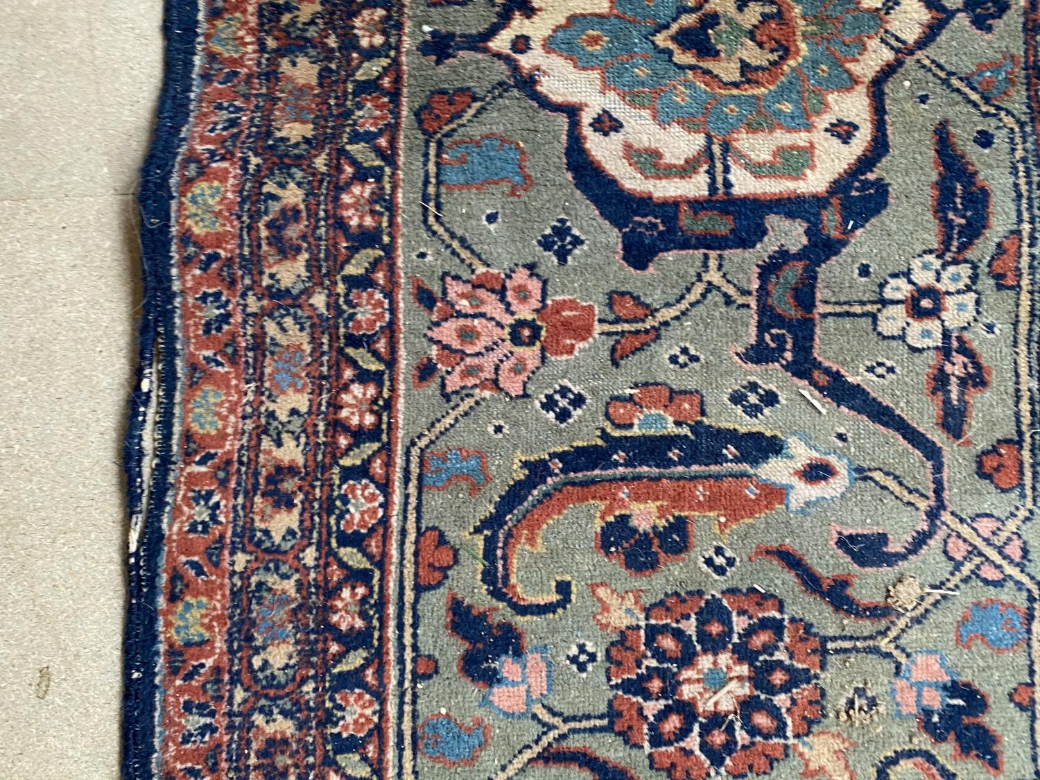Large old Persian rug with dark blue ground and central panel within a green stylised rectangular - Image 5 of 8