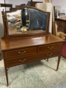 Edwardian inlaid mahogany dressing table of 2 short and 1 long drawer below a swing mirror, on