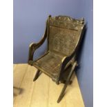 Carved oak Glastonbury arm chair (condition, some wear)