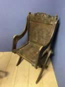 Carved oak Glastonbury arm chair (condition, some wear)