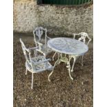 Small circular white garden table and chairs