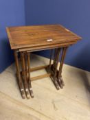 Nest of 3 cross banded mahogany occasional tables on spider legs, 51L x 36cmW (condition general