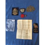 Qty of military and other badges and a brass coat of arms