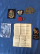 Qty of military and other badges and a brass coat of arms