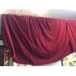 Pair of red coloured fabric lined curtains