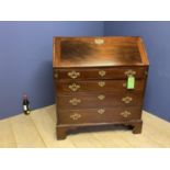 Good George III figured mahogany bureau, with a a good stepped fitted interior above 4 long