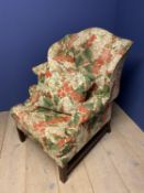 Traditional winged armchair, on mahogany stretcher base, (condition generally good but upholstery