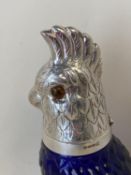 Heavy moulded blue glass claret jug with an EPNS hinged lid in the form of a Cockatoo, 25cmH