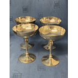Set of 4 hallmarked silver champagne saucers, London 1929. maker SG. The base engraved copy of a cup
