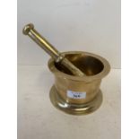 Heavy polished brass pestle and mortar 13cm D Good condition, old minor wear