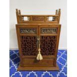 A modern decorative Chinese cabinet and small chest of drawers