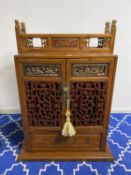 A modern decorative Chinese cabinet and small chest of drawers