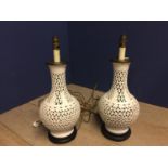 Pair of white ceramic onion shaped table lamps, on wooden stands