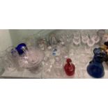 Large quantity of glass ware including quantity of cut glass, plain glass, decanters, ruby jug,