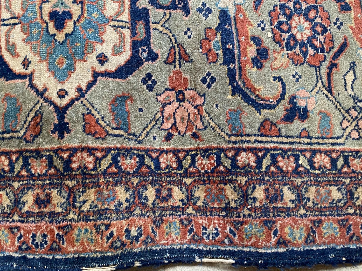 Large old Persian rug with dark blue ground and central panel within a green stylised rectangular - Image 6 of 8