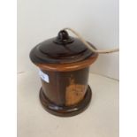 Polished lignum Vitae cylindrical string box 13cm D, (condition, chip to rim of lid and a crack to