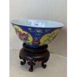 Small China bowl, blue ground with 4 yellow floral panels, marks to base, 15cm D (condition mainly