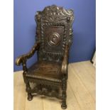 18th century and later Jacobian style hall chair with later carved additions and carved panel to