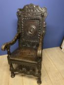 18th century and later Jacobian style hall chair with later carved additions and carved panel to
