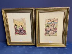 Pair of signed Japanese Woodblock prints depicting Geishas in flamboyant costumes in gilt frames, 22