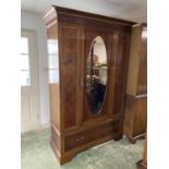 Good quality Edwardian inlaid mahogany wardrobe with oval mirrored door above a drawer 137 L x 207
