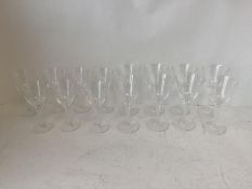 LALIQUE A suite of 8 large and 7 small wine glasses with decorative scrolling hexagonal stems, the