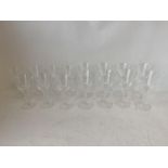 LALIQUE A suite of 8 large and 7 small wine glasses with decorative scrolling hexagonal stems, the