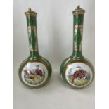 A pair of C19th Austrian green and gilt bottle vases and covers decorated pheasants 36 cm H