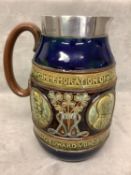 A Doulton ware commemorative jug with Royal blue borders and portrait and Medallions of King