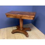 Late Regency mahogany fold over pedestal card table with circular green baize interior 92cmL.