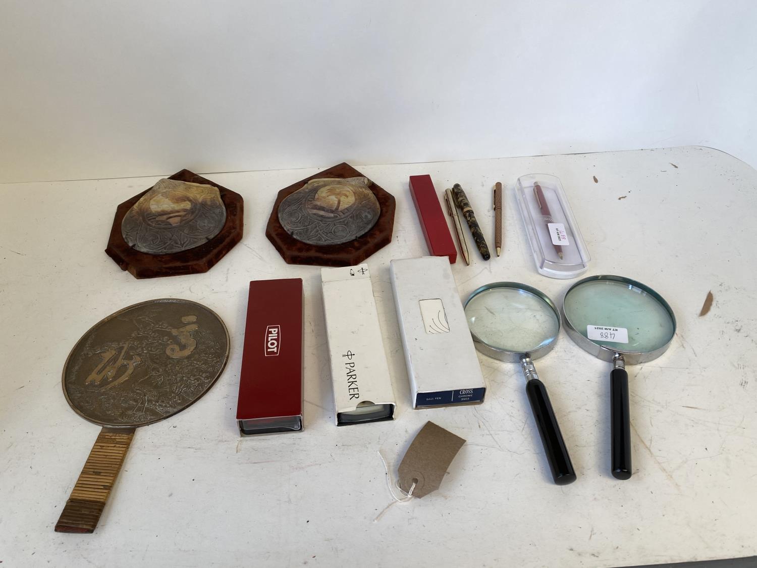 Quantity of pens, magnifier glasses etc Japanese polished bronze hand mirror with cranes and