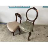 Victorian walnut upholstered nursing chair and a Victorian balloon back chair, (repaired)