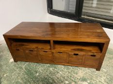 Good quality light oak TV cabinet with doors containing fitted sliding shelves above 3 long