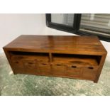 Good quality light oak TV cabinet with doors containing fitted sliding shelves above 3 long