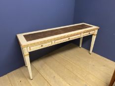 Cream and gilt painted narrow writing table of 3 drawers and tapered reeded legs below