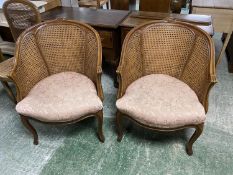Pair French walnut tub chairs with double bergère cane backs and overstuffed seats and a pair of