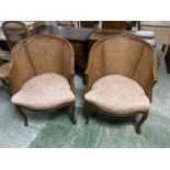 Pair French walnut tub chairs with double bergère cane backs and overstuffed seats and a pair of