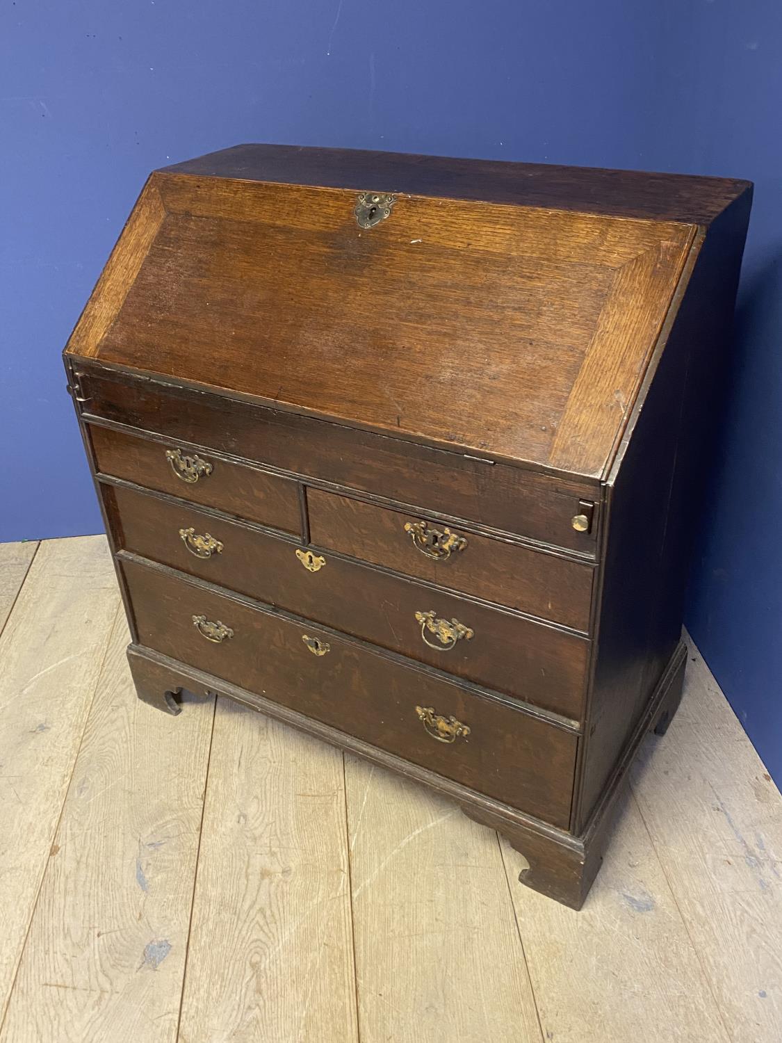 C18th oak bureau of 2 short over 2 long drawers with stepped fitted interior around a well with - Image 5 of 5