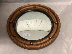 Small circular Irish style gilt painted convex wall mirror with ball decorations to the frame 42