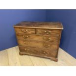 Georgian mahogany chest of 2 short over 3 long graduated drawers with brass drop handles on shaped