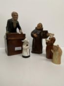 A pottery figurine of a standing monk 18 cm H and a teacher at his lectern 24 cm H forming the lid