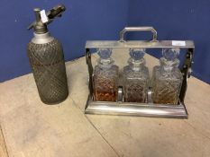 Silver plated 3 bottled tantalus (no key), and an old soda syphon